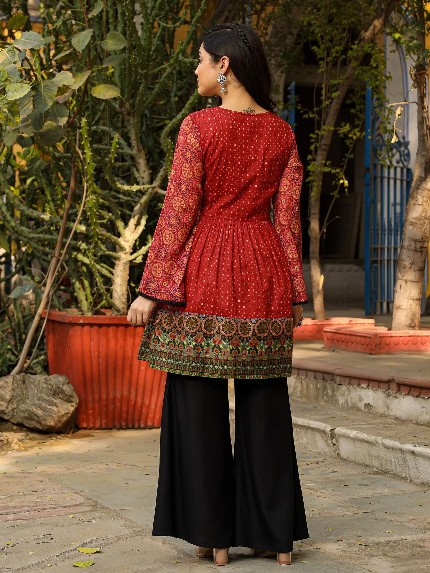 Jashvi Rust Ethnic Motif Printed Cotton & Chiffon Peplum Tunic With Thread Embroidery & Tassels